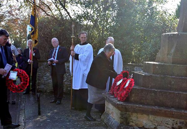 3 Linda Needle places the WI wreath.jpg